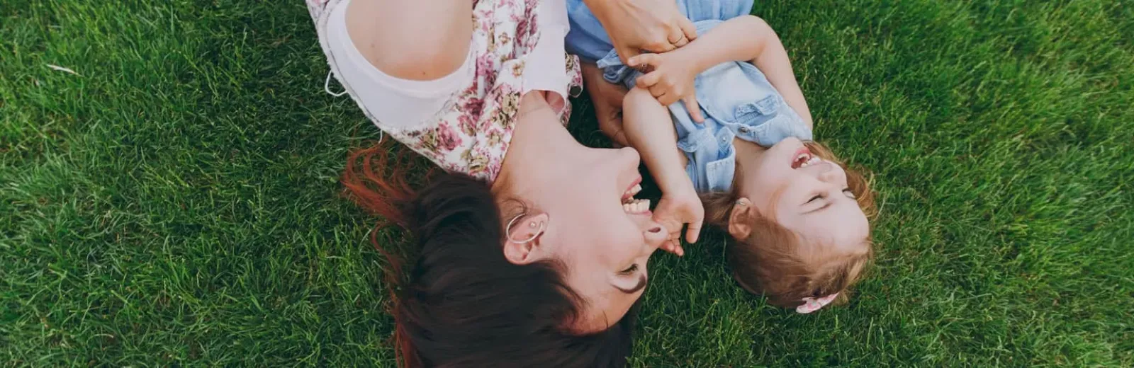 Mom playing with daughter outside